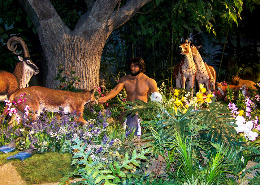 An exhibit shows Adam in the Garden of Eden at 