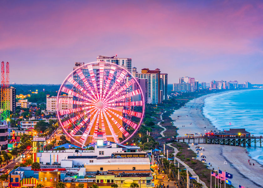 View of Myrtle Beach Skywheel and Strip at sunset